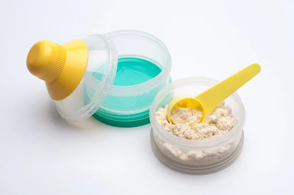 Container of powdered milk for infants on white background. — Stock Photo, Image