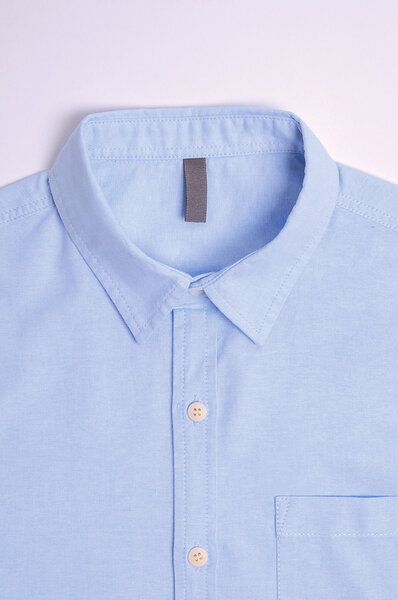 Blue plain cotton shirt White background