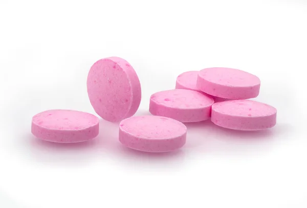 Růžové pilulky closeup drog makro fotografie — Stock fotografie