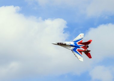 Fighter in the air performing a loop clipart