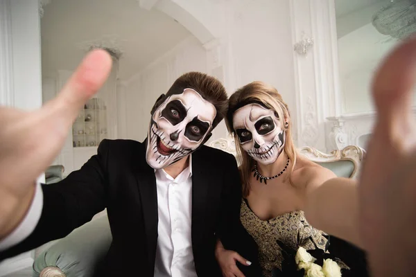 Halloween Zombie party and horror. Halloween couple with makeup