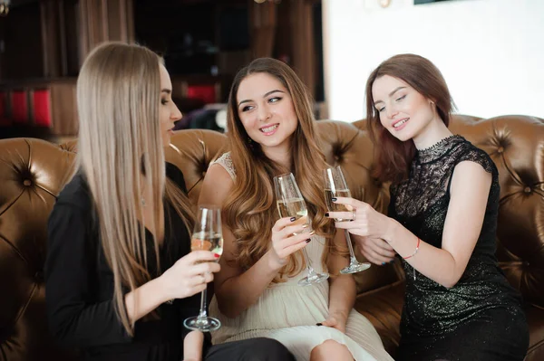 holidays, nightlife, bachelorette party and people concept - smiling women with champagne glasses.