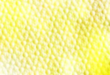 Lekeli açık sarı vektör arkaplan. Renkli su damlaları olan modern soyut çizimler. Poster ve web siteleri için tasarım.