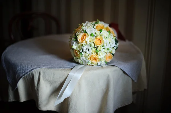 Bridal wedding  bouquet of roses on the table