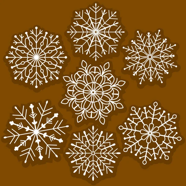 Karmaşık mandala tarzı detaylara sahip dekoratif beyaz kar taneleri. Kışlık kartlar, ambalaj, tekstil, Noel projeleri ve mevsimlik markalaşma için mükemmel..