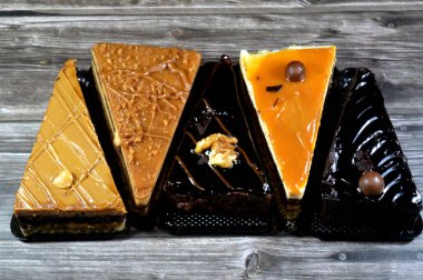 assorted cakes, mousse cake with caramel, coffee and chocolate flavors, creamy fudge cake and biscuit with whipped cream cakes, Mousse is a traditional French dessert called mousse, whipped cream