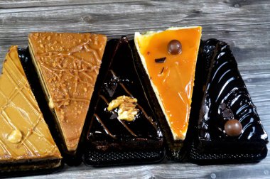 assorted cakes, mousse cake with caramel, coffee and chocolate flavors, creamy fudge cake and biscuit with whipped cream cakes, Mousse is a traditional French dessert called mousse, whipped cream