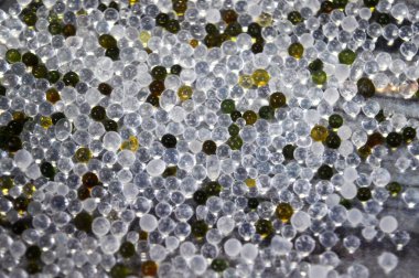 Silica gel, a porous, amorphous form of silicon dioxide SiO2 used as a desiccant to absorb moisture and control humidity, traps water molecules to protect products like electronic from moisture damage