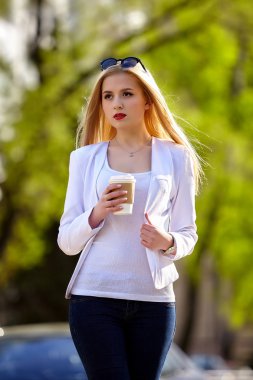 Young  woman  with coffee.