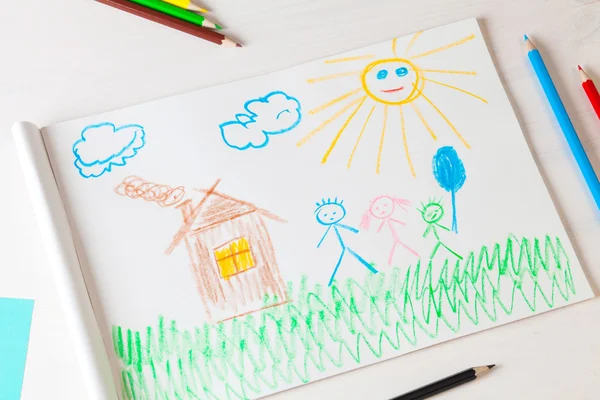 Child draws a pencil drawing of the house and his family. — Stock Photo, Image