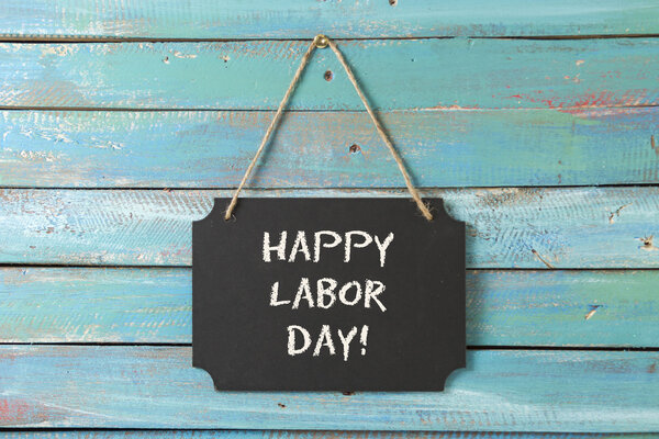 Labor Day chalk sign on wood background