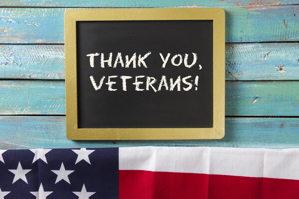 veterans day chalk sign on wood background