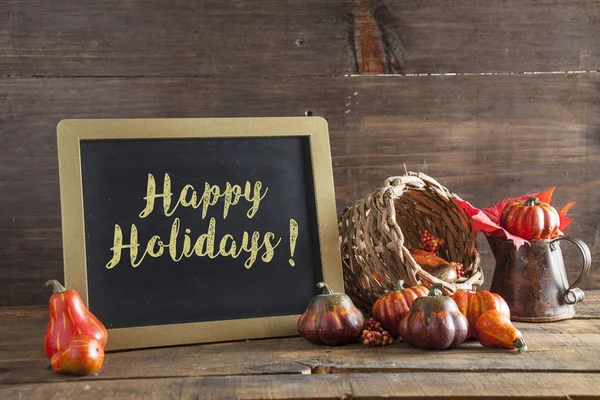 Happy Holidays Written In Yellow Chalk On Black Chalkboard Backg — Stock Photo, Image