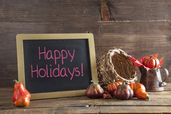 Happy Holidays Written In Red Chalk On Black Chalkboard Backgrou — Stock Photo, Image