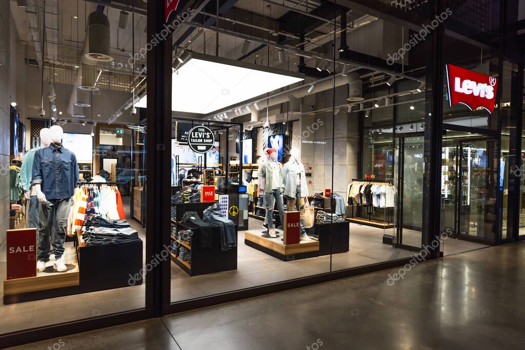 Levis retail storefront with denim jeans, jackets, and mannequins in a modern shopping mall. London, UK, 4 July 2023