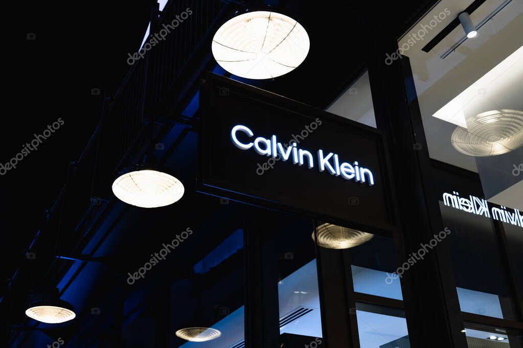 Modern fashion retail scene featuring a Calvin Klein shop sign. London, UK, 4 July 2023
