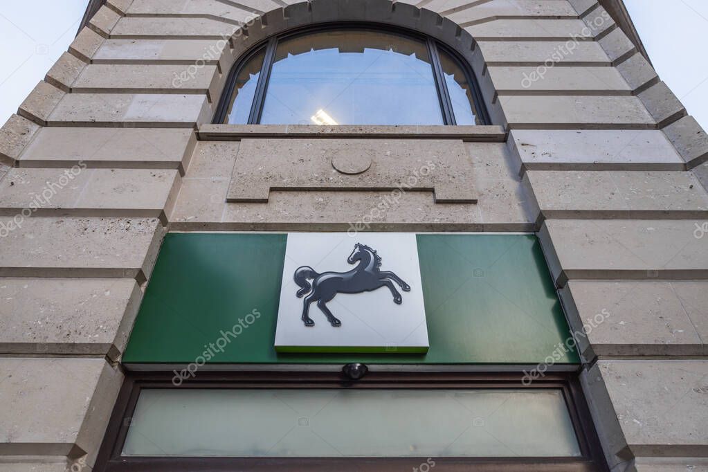 Lloyds Bank signage with the black horse emblem on a stone facade, representing UK banking, finance, and brand identity in an urban streetscape. London, UK, 21 July 2023