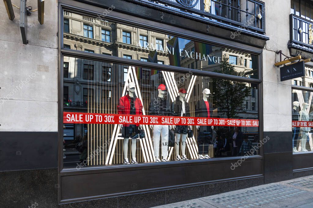 Closeup of Armani Exchange branding and boutique exterior. London, UK, 23 July 2023