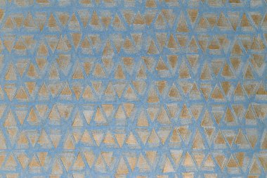 Işıldayan folyo efektli soyut mavi ve altın duvar kağıdı deseni.