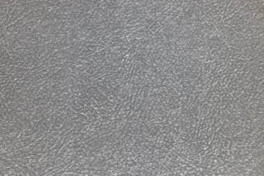 Detailed close up of a sparkling granular surface, creating a subtle and sophisticated grey pattern.