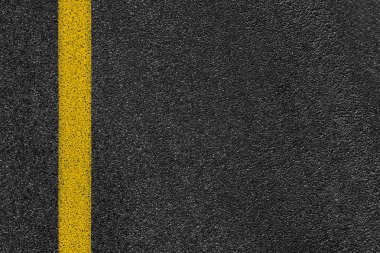 Level asphalted road with a dividing yellow stripes. The texture of the tarmac, top view. clipart