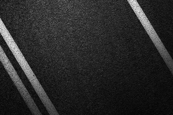 Level asphalted road with a dividing white stripes. The texture of the tarmac, top view. — Stock Photo, Image