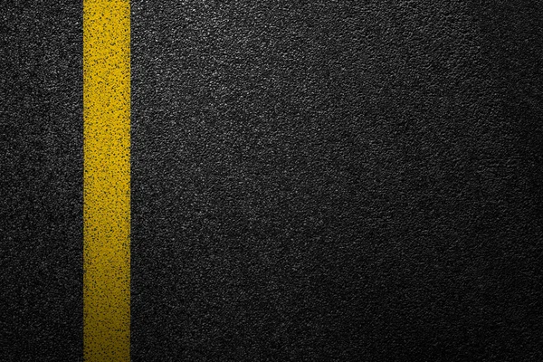 Level asphalted road with a dividing yellow stripes. The texture of the tarmac, top view. — Stock Photo, Image