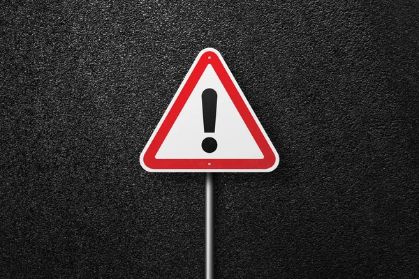 Road sign triangular shape with exclamation mark on a background of asphalt. The texture of the tarmac, top view. — Stock Photo, Image