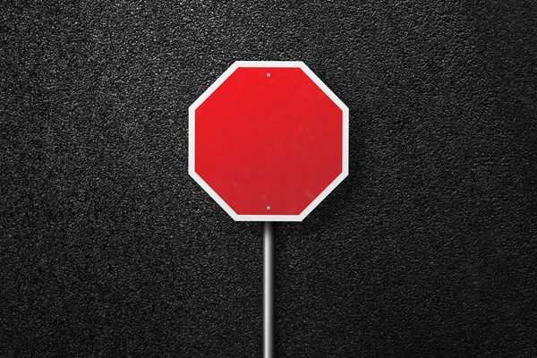 Red road sign on a background of asphalt. The texture of the tarmac, top view. — Stock Photo, Image