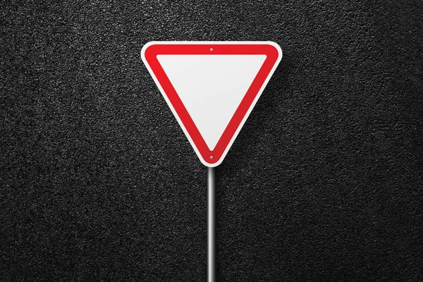 Road sign of the triangular shape on a background of asphalt. Give way. The texture of the tarmac, top view. — Stock Photo, Image