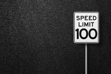 Road sign on a background of asphalt. Speed limit. The texture of the tarmac, top view. clipart