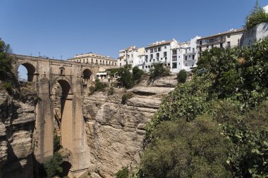 views of the monumental areas of the city of Ronda in the province of Malaga clipart