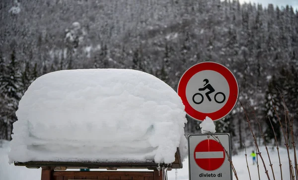 sign of prohibition to motorcycles covered by snow