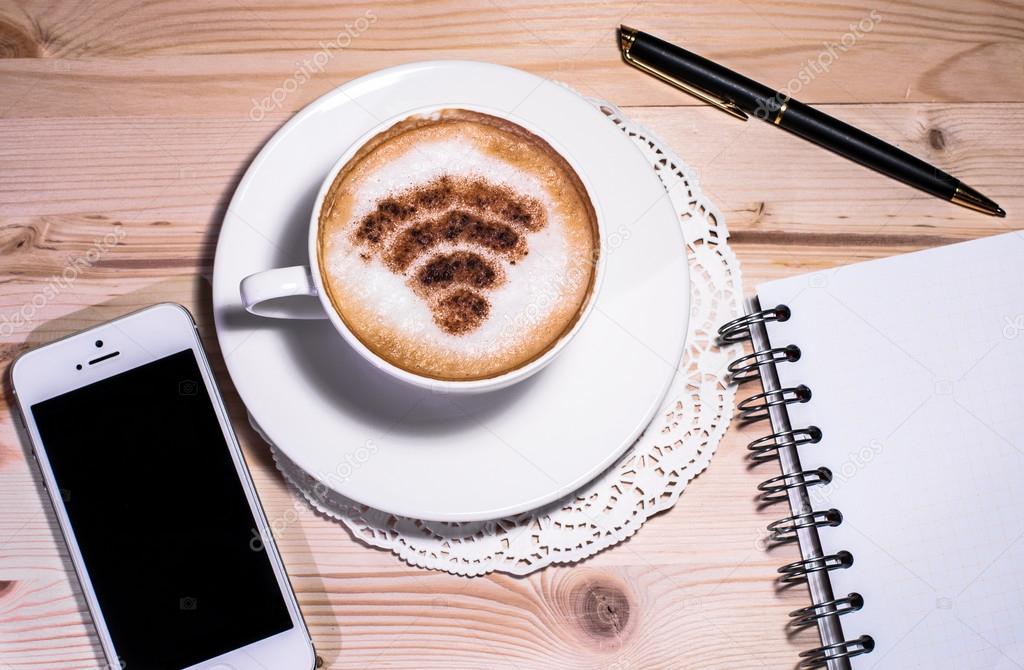 Wi-Fi logo made of cinnamon as coffee decoration. Free wi-fi area at cafe/ restauran