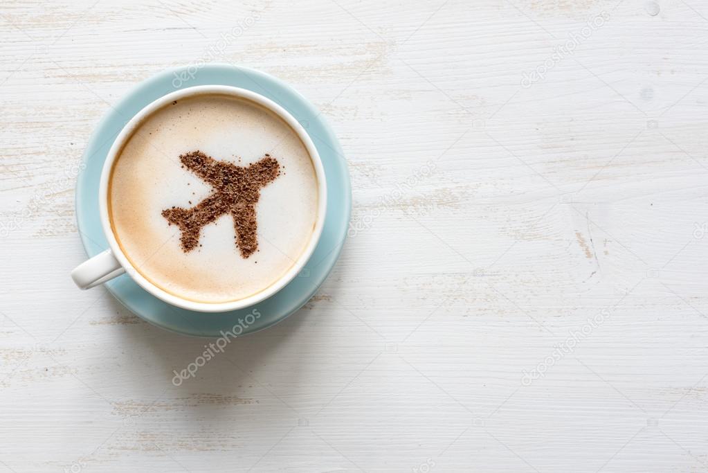 Cup of coffee with cinnamon airplane
