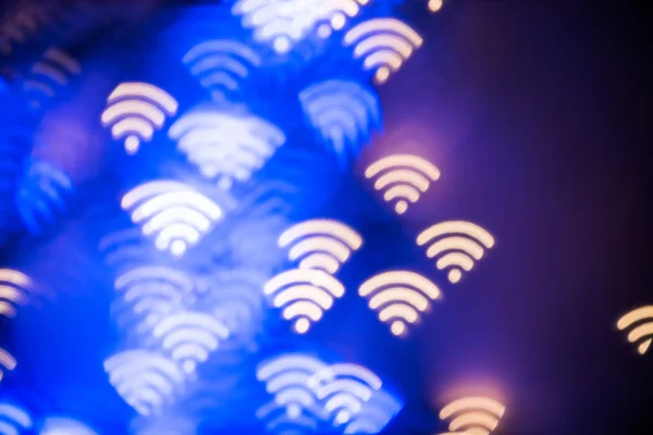 WiFi symbol. Abstrakt glödande suddig bakgrund. Defocused blinkande formade lampor. Wi-fi bakgrund — Stockfoto