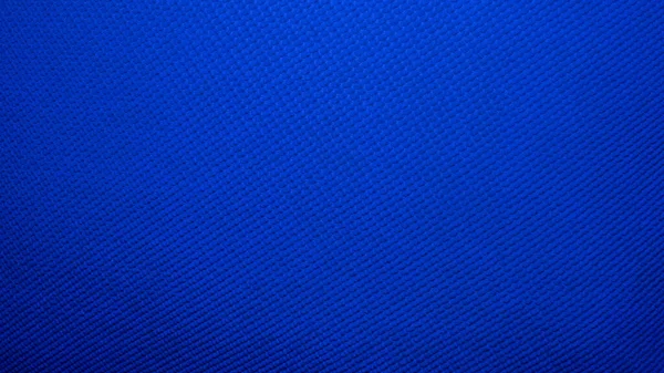 Blue matte classic background, abstract background in blue pimples, copy space. Desktop wallpaper