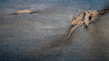 Yırtılmış kot pantolon, kot kumaş, kot kumaştan arka plan