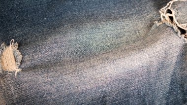 Textile from dark blue jeans. Clothing. Denim background