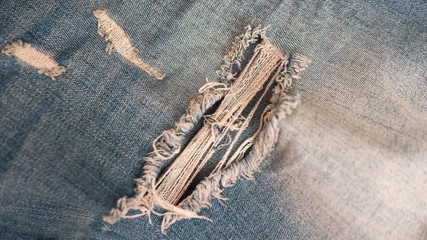 Denim Achtergrond Blauwe Distressed Stof Blauwe Gescheurde Jeans Close Denim — Stockfoto