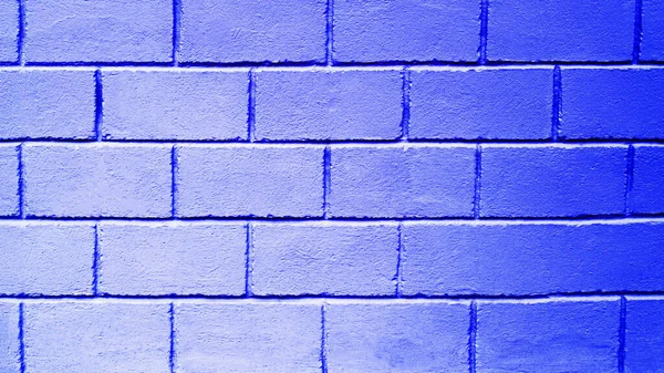 レンガブロックから青の背景 大きなレンガで作られた壁の質感 コピースペース ネオンの壁は青い — ストック写真