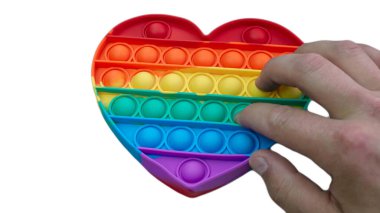 Stres önleyici. Popüler bir stres giderici oyuncak. LGBT kalp bayrağı. Parmağını silikon oyuncak antistrese bastırıyorsun. Patlat..