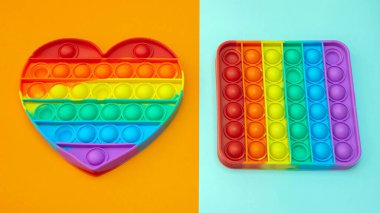 Stres önleyici. Popüler bir stres giderici oyuncak. LGBT kalp bayrağı. Parmağını silikon oyuncak antistrese bastırıyorsun. Patlat..