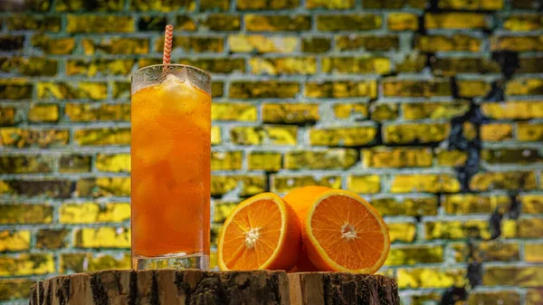 Orange Juice Glass Straw Transparent Glass Brick Wall Background Yellow —  Fotos de Stock