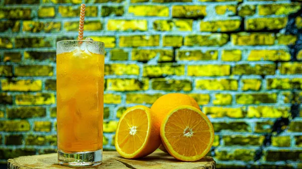 Orange Juice Glass Straw Transparent Glass Background Yellow Brick Wall —  Fotos de Stock