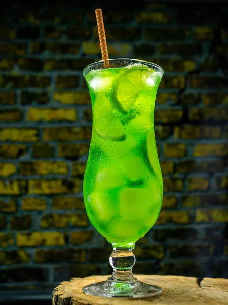 Alcoholic Cocktail Glass Brick Wall Background Vertical Picture Green Lemonade —  Fotos de Stock