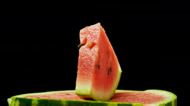 Slice Watermelon Spinning Black Background — Stock Video
