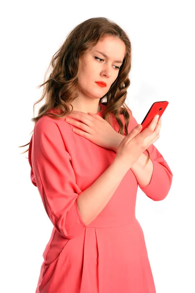 Young woman reading the sad news on the phone. Emotional crisis, troubles and love depression concept. Isolated on white background.