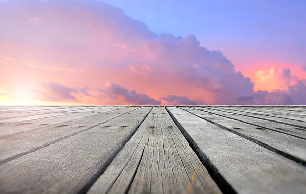 Wooden plates with sunset sky — Stock Photo, Image