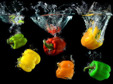 bell peppers droping in to clean water clipart